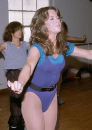 Beverly Hills, CA - Jane Fonda (center) jogs in place in an early morning exercise class at her Jane Fonda Workout Studio, December 15, 1983. (Reed Saxon/AP)