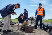 JIAAC Investigator Augusto De Santis (played by John Philip Vazquez) examines the black box of downed SOL Lineas Aerias Flight 5428.