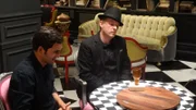 Host Jason Silva and Master Illusionist Apollo Robbins stare at the broken bottle, which they managed to avoid smashing in the Russian Roulette game.
