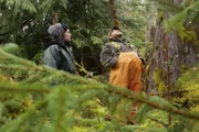 PORT PROTECTION, ALASKA- Timothy "Curly" Leach and Amanda Makar eye a tree as potential firewood.
