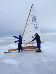 Eric and Rene Potvin standing near the ice sailboat.