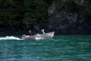 PORT PROTECTION, ALASKA- Mary Miller and Amanda Makar drive along the coast to go hunting. (Photo Credit: National Geographic Channels/Corey Cooper)