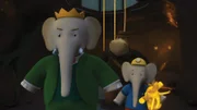 König Babar und Heldopotamus eilen Badou zu Hilfe. Prospero ist aufgetaucht.