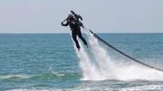 Eric Young wearing a jet pack.