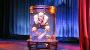 Seth Grabel in his new tank performing his water torture cell tank act.