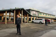 Host Anthony Melchiorri poses outside Hooligan's Lodge in Soldotna, Alaska.