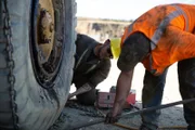 Kevin fixing flat tire