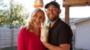 Dave and Jenny pose with Sarah Walker's unconventional unicorn head squirrel feeder, as seen on HGTV's series Almost Home. GREAT MOMENT_02