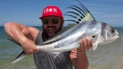 Eric Young catching a fish.