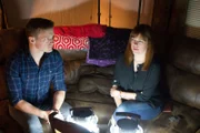 Adam Berry looks over at Amy Bruni during an investigation.