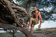 Ed Stafford climbing to his makeshift shelter, Namibia.