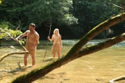 Bulent and Sara trek through the river.