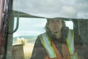 Parker Schnabel looking  through window