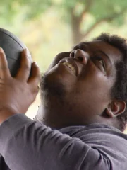 Ontreon working out with a weight ball.