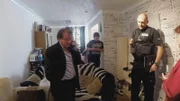 Police officer is investigating a house