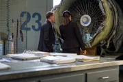 REENACTMENT - The Main Investigator (played by Mark Gibson) and the Second Investigator (played by Jenny Young) analyze the engine of downed UPS Flight 1354 to see what caused it to crash.