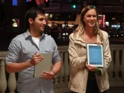 Las Vegas, Nevada - Two Brain Bumpers game participants use tablets to write down answers to where they think the ball dropped on the giant grid based on their memorization of the placement of paddles before they disappeared.