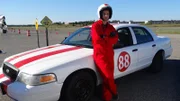 Course participant, Joe, poses in front of car #88.