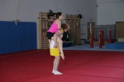 LONDON - Anthony Wise and Emma Jagger perform a piggy back. Showing good center of mass.