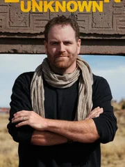 Josh Gates in front of the Gate of the Sun.