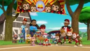 L-R: Zuma, Rocky, Farmer Al, Rubble, Mayor Goodway, Skye, Chase, Ryder, Marshall, Everest, Raimundo (hinter, r.), monkeys.