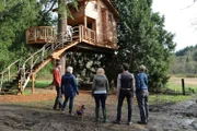 Pete Nelson and the owners during the treehouse reveal.