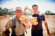 L-R: Mick Clark and Neville Perry with huge nuggets.
