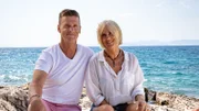 Damira Erdenberger (R) and Hans Erdenberger (L) sitting on the rock by the sea on the shore of Brac Island, Croatia, as seen on Mediterranean Life