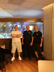 Wayde, Brett and John show off the tank.