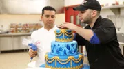 Ralph decorating the top of the cake with Ralph in the background.