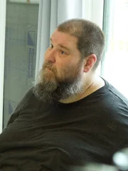 Mark sitting in the kitchen