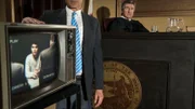 Laweyer and judge in courtroom, showing footage of Vireak Sarik’s police interview on a TV screen.