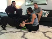 Adopters play with Black at the home check.