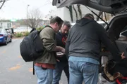 HSI Agent Thomas Codwallader, Anthony Petron, and HSI Task Force Officer David Schweizer look over a plan for surveillance of probable stash house. (National Geographic/Lucky 8 TV)