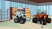 Blaze (re.hi.) und AJ (re.vo.) erhalten einen Rundgang durch die Bäckerei von Reifenhausen. Kurze Zeit später geraten die für die Kuchen und Torten zuständigen Backroboter außer Kontrolle und richten in der Stadt ein Chaos an.