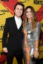 LOS ANGELES, CALIFORNIA - FEBRUARY 19: (L-R) David Weil and Nikki Toscano attend the World Premiere Of Amazon Original "Hunters" at DGA Theater in Los Angeles.