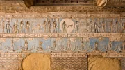 Ancient Egyptian carved and painted ceiling in the hypostyle hall of Abydos Temple. Note the goat Aries and the two fish of Pisces.
