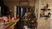 Angela Matthews decorating her Christmas Tree.
