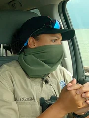 Warden Gulczewski sitting in car with her hands interlocked