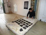 Dressmaker with his printed out materials.