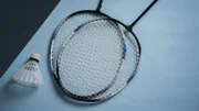 Badminton racket on the colored background