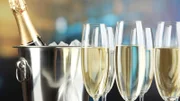 Champagne in glasses on  restaurant background