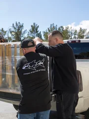 Taking the dentist tank off the truck.