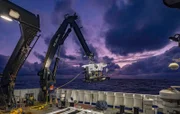 An ROV being recovered onto the NOAA research vessel Okeanos Explorer.