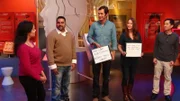 Jersey City, NJ - Teammates reveal the phrase they have come up with through playing "Time Travel Telephone" to host Jason Silva.  Time Travel Telephone – explores the evolution of spoken and written language. The object of the game is to communicate a sentence or phrase (such as “pen is mightier than the sword”) correctly through four people – with a catch. 1. The first person (Teammate A) can only use gestures and grunts, as early humans did tens of thousands of years ago. 2. The second person (Teammate B) can only use hand-drawn pictures, as our ancestors did before there was written language less than six thousand years ago. 3. The third person (Teammate C) gets to travel through time to today and can only use words to communicate. The trick is, they can use every word except the words they believe to be in the phrase they’re trying to communicate to the fourth person. 4. The fourth person (Teammate D) then reveals on a white board what they think the phrase is and we see how close they are to the original phrase/ idiom that Jason reveals on another white-board.  (photo credit:  NGT/Ben Spanner)