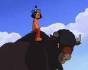 Yakari auf dem Rücken des Spähers der Bisons.