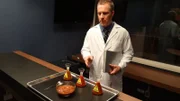 New York, NY - A scientist sets up an experiment designed to test the willingness of participants to inflict pain on a stranger.