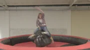 LONDON - Rebecca shows us how to master the art of riding a rodeo bull. Rebecca demonstrates the technique that see's the rider raise one arm above her head.