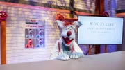 Woozle ist ein echter Woozleist auf dem Gebiet der Augen. Als Dr. Dr. Holzauge testet er seine Patienten auf Blau-Grün-Schwäche und andere Sehprobleme.