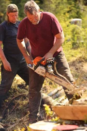 PORT PROTECTION, ALASKA- Hans Porter cuts wood for his duck paddock in Port Protection, AK.